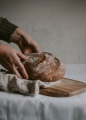 2023-02-21 09_41_55-person holding brown bread on brown wooden chopping board photo – Free Food Imag.png